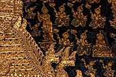 Wat Xieng Thong temple in Luang Prabang, Laos. The main entrance of the sim. Detail of the nagas at the sides of the  in the  that  